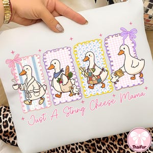 May include: White square pillow with a whimsical design featuring four cartoon ducks in different outfits, each framed with a unique border. The text "Just A String Cheese Mama" is written in pink script across the bottom.