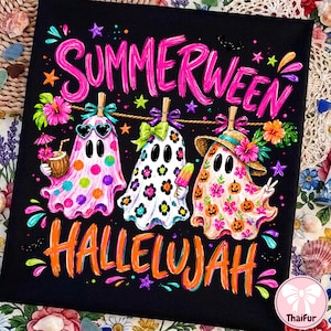 May include: A black t-shirt featuring a colorful graphic with the text SUMMERWEEN HALLELUJAH. The design shows three ghosts hanging on a clothesline, decorated with polka dots, floral patterns, and pumpkins, alongside tropical accents like a coconut drink.