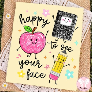 May include: A cream-colored greeting card featuring a pink apple, a black composition notebook, and a yellow pencil with a pink eraser, all with smiling faces. The text reads happy to see your face, surrounded by small colorful stars and flowers.