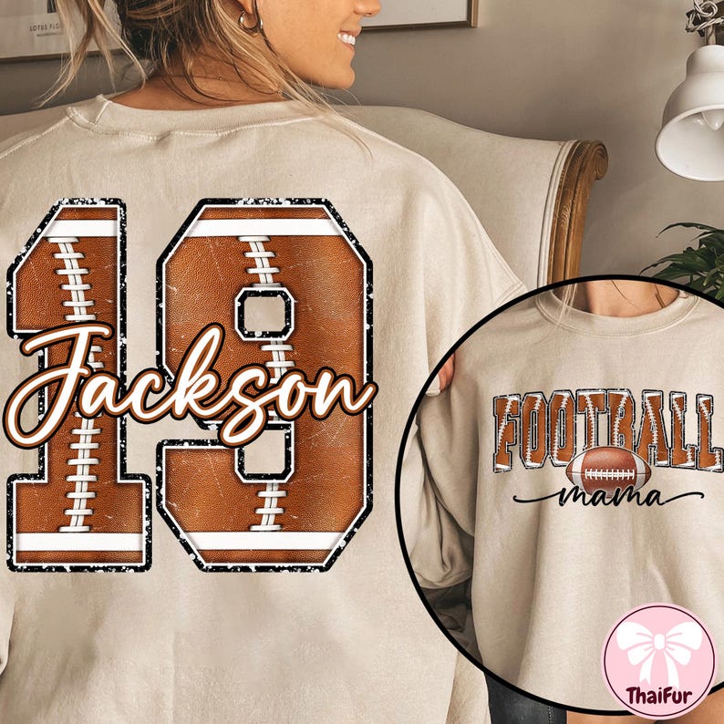May include: Beige sweatshirt with a football-shaped '19' design and the name 'Jackson' in a script font. A smaller image shows 'FOOTBALL mama' with a football graphic. The sweatshirt is a casual, sporty apparel item.