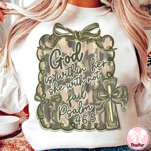 May include: White sweatshirt with a graphic design featuring the text "God is within her, she will not fail. Psalm 46:5." The design includes a cross and bows in shades of green and tan.