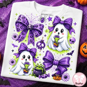 May include: A white t-shirt featuring a graphic print of two white ghosts with purple bows, a purple leopard print bow, a purple solid bow, a purple cauldron with green liquid, a skull candy apple, a small skull, and the text WISHING WELL.