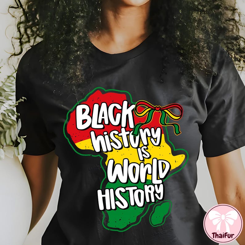 May include: Black t-shirt with a colorful graphic of the African continent in red, yellow, and green. The text "BLACK history IS WORLD HISTORY" is written in white, with a ribbon design.