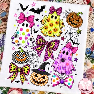 May include: A white fabric sheet featuring a colorful Halloween-themed print. The design includes three ghosts with bows, two jack-o'-lanterns, one wearing a witch hat, several bows with leopard and polka dot patterns, spider webs, spiders, and bats.