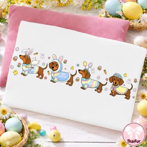 May include: White rectangular pillowcase featuring four dachshunds dressed in Easter-themed costumes. The dogs are wearing bunny ears, angel wings, and colorful outfits. Easter eggs, carrots, and chicks are also depicted.