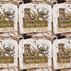 May include: A cream-colored sweatshirt featuring a graphic of a deer wearing a camouflage hat, a hunting blind, binoculars, and cattails. The text reads Ready to Scout Out followed by various grade levels including Kinder Garten, First, Second, Third, Fourth Grade, and Pre-K.