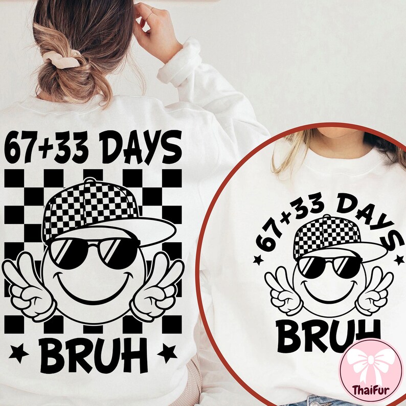 May include: White sweatshirt with a graphic design featuring a smiley face wearing sunglasses and a checkered hat. The text "67+33 DAYS" is above the graphic, and "BRUH" is below. The design includes peace signs.
