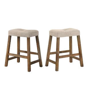 May include: Two wooden bar stools with light-colored fabric seats. The stools have a rustic, farmhouse style with a natural wood finish and a footrest. The seats are rectangular with a slight curve for comfort.
