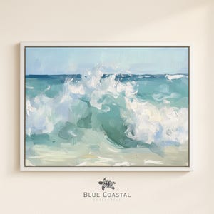 May include: A framed painting of a crashing ocean wave. The artwork features a palette of blues, greens, and white, with visible brushstrokes creating texture. The painting is set against a light background, with the text "BLUE COASTAL COLLECTIVE" at the bottom.