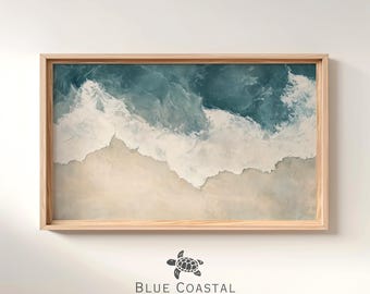 May include: Abstract painting of ocean waves crashing on a sandy beach. The painting is framed in a light wood frame. The painting is titled "Blue Coastal Collective".