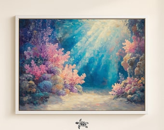 May include: A framed art print depicting an underwater scene with coral and sunlight. The artwork features vibrant pink, purple, and orange coral against a backdrop of deep blue water. The print is framed in a white border, with the text "BLUE COASTAL COLLECTIVE" at the bottom.