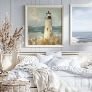 a painting of a lighthouse hangs above a bed
