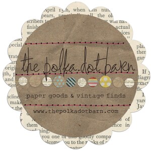 May include: A brown paper circle with the text "the polka dot barn" in black script. The circle is surrounded by a string of colorful polka dots and the text "paper goods & vintage finds". Below the polka dots is the website address "www.thepolkadotbarn.com".