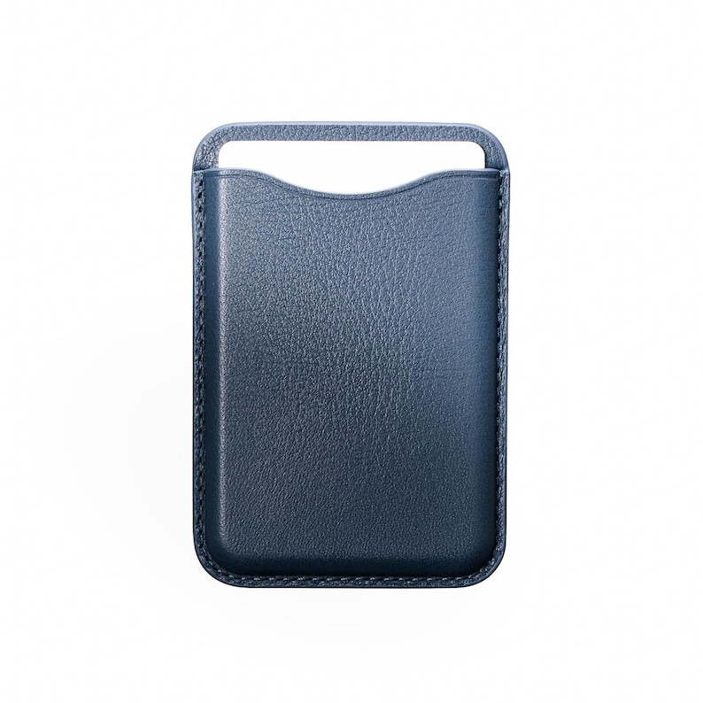 May include: A navy blue leather phone case with a handle at the top. The case has a textured surface and a curved cutout at the top for easy access to the phone. The edges are stitched with a contrasting thread.