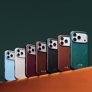 May include: A row of seven smartphone cases in various colors including light blue, cream, burgundy, brown, black, tan, and dark green. Each case features a camera cutout and personalized initials or names printed at the bottom.