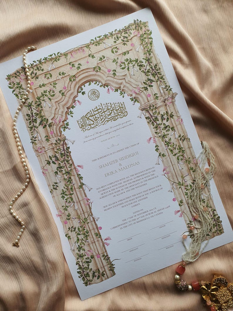 May include: A rectangular marriage certificate featuring an illustration of a stone archway adorned with green vines and pink flowers. The document includes black printed text, Arabic calligraphy, and signature lines, accented by a string of white pearls.