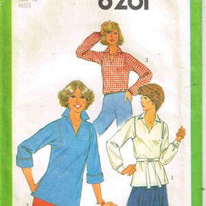 May include: Simplicity sewing pattern number 8261 for a blouse with three different styles. The pattern is for size 12 miss.