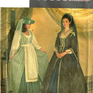 May include: Simplicity Costumes sewing pattern for two historical costumes. The pattern includes a green and white striped dress with a white apron and a dark green and blue dress with a lace trim. The pattern is labeled with the number 7756.