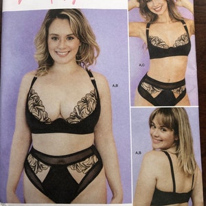 May include: A Simplicity sewing pattern for a black lingerie set with gold embroidery. The pattern is for sizes A, B, and C. The pattern includes a bra and high-waisted underwear.