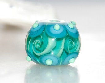 Deep Swirly Green Carousel Trimmed Lampwork Glass Bead