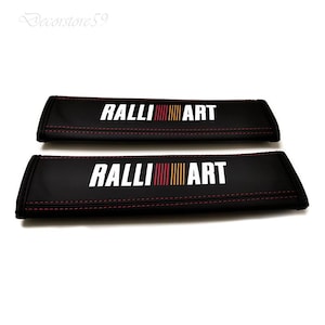 2 Copricintura Ralliart con cuciture rosse e logo bianco, rosso e arancione - 240x65 mm