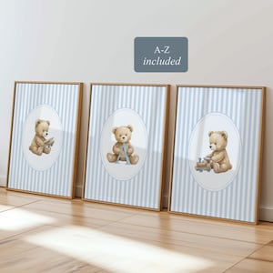 May include: Three framed prints with watercolour teddy bears on a blue and white striped background. Each print shows a different bear with a toy or letter. The text "A-Z included" is in the upper right corner.
