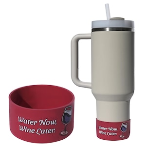 May include: A white travel mug with a black handle and a red silicone coaster. The coaster has the text "Water Now, Wine Later." printed on it and a cartoon image of a wine glass.