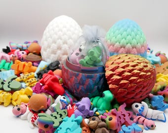 May include: A collection of colorful, small, plastic dragon figurines, some in egg-shaped containers. The eggs are decorated with a variety of patterns, including scales, stripes, and polka dots. There are also two larger, white and pastel-colored eggs in the background.