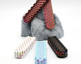 May include: Five different colored knife scales with a honeycomb pattern. The scales are made of a durable material and are available in a variety of colors.