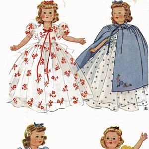 May include: Three vintage doll dress patterns with illustrations of the finished dresses. The first dress is white with red floral print, the second dress is white with blue polka dots and a blue cape, and the third dress is blue with pink floral print.