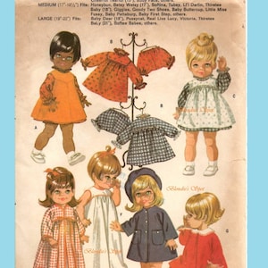 May include: A vintage sewing pattern for doll clothes. The pattern includes instructions for making a variety of outfits for dolls, including dresses, coats, and pajamas. The pattern is illustrated with drawings of dolls wearing the different outfits.