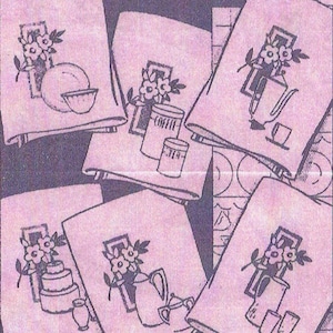 May include: Five different kitchen towel designs with black and white illustrations of flowers, teapots, coffee cans, cake, and teacups. The towels are all white with a pink background.