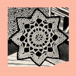 May include: A white crocheted star-shaped doily with a detailed center pattern.