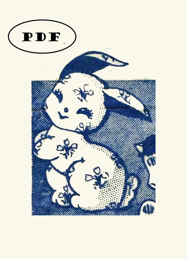 May include: A white rabbit with blue floral pattern on a blue background. The rabbit is sitting up with its ears up and its eyes closed. The rabbit is smiling.