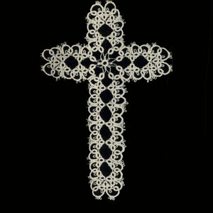 May include: A white lace cross with a delicate, intricate design. The cross is made of fine, white thread and has a traditional, religious style.