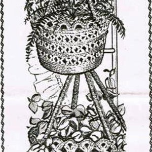 May include: A black and white illustration of two crocheted hanging plant baskets. The top basket is larger and has a fern plant inside. The bottom basket is smaller and has a leafy plant inside. Both baskets are suspended from a wooden frame.