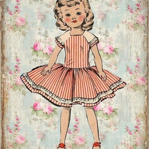 May include: A vintage paper doll with blonde hair wearing a red and white striped dress with a white collar and lace trim. The doll is standing on a floral background.