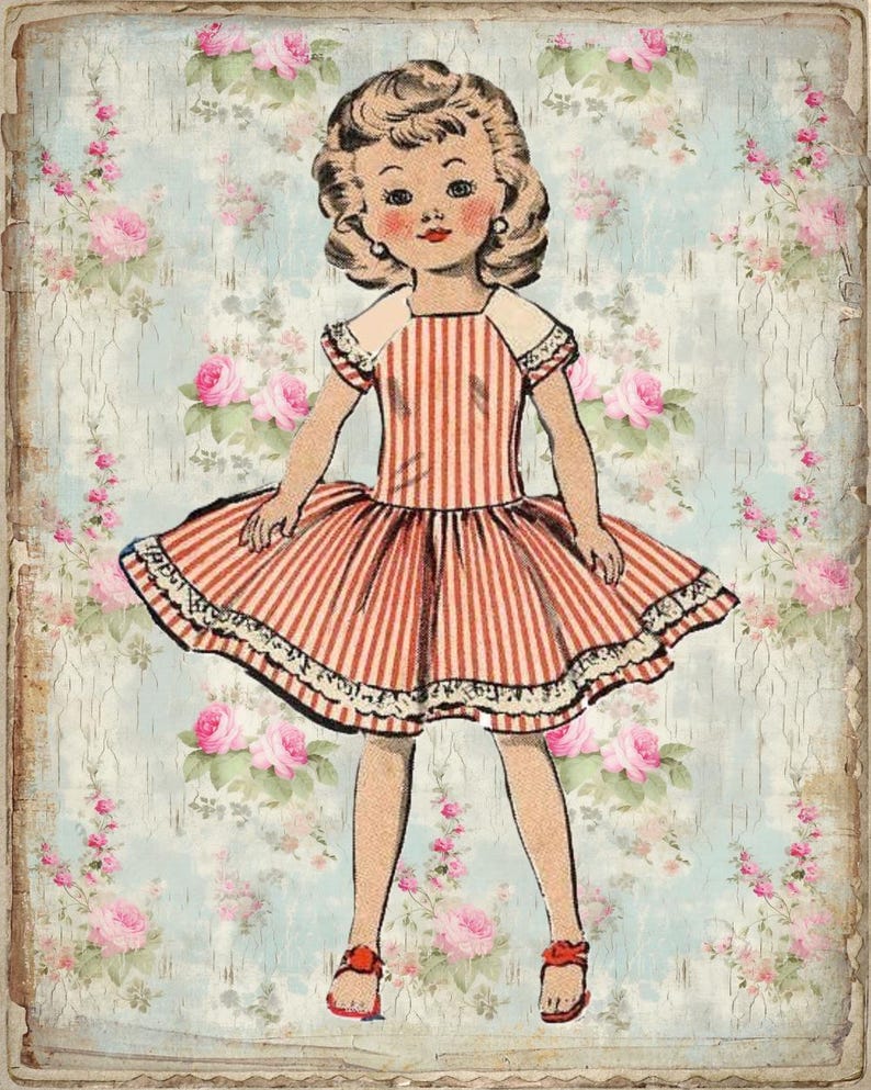 May include: A vintage paper doll with blonde hair wearing a red and white striped dress with a white collar and lace trim. The doll is standing on a floral background.