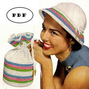 May include: A white crochet hat with blue, pink, and green stripes. The hat has a wide brim and a small bow on the side. The hat is being worn by a woman with a bright smile.