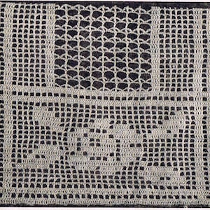 May include: A white crocheted doily with a square design. The doily has a delicate lace pattern with a central square motif.