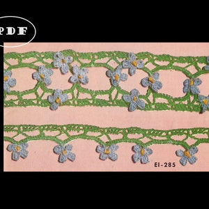 May include: A vintage crochet lace pattern with a green background and blue flowers. The pattern is labeled "EI-285".