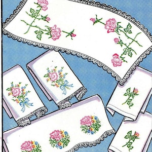 May include: A set of five white handkerchiefs with embroidered floral designs. The handkerchiefs feature pink, blue, and yellow flowers with green stems and leaves. The handkerchiefs have lace trim around the edges.