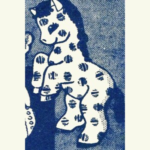 May include: A white spotted horse with a black mane and tail stands on a blue background. The horse is facing the left side of the image.