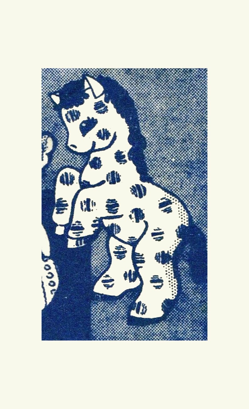 May include: A white spotted horse with a black mane and tail stands on a blue background. The horse is facing the left side of the image.