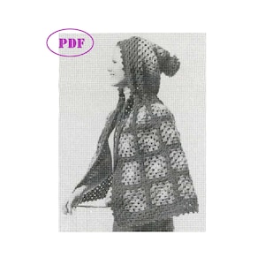 May include: Black and white photo of a person wearing a crocheted hooded cape and hat. The cape has a square pattern and the hat has a pom-pom on top.