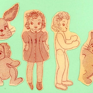 May include: Vintage paper dolls and animal cutouts in red ink on cream-colored paper. The set includes a doll in a red dress, a side-view doll, a bunny, a lion, and a cat. The background is a light green color.