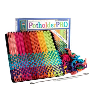 May include: A colourful loom with yarn and a weaving needle. The loom is labelled "Potholder PRO" and "50% LARGER LOOM".