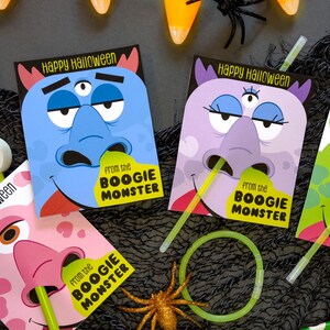 May include: Four colorful Halloween treat bags with monster faces and the text "Happy Halloween" and "From the Boogie Monster".
