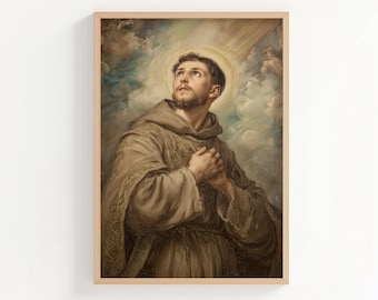 May include: A framed religious portrait of a man in a brown robe, looking upwards with a halo around his head. The background features clouds and light rays, creating a celestial atmosphere. The artwork is displayed in a wooden frame.