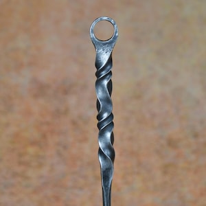 Hand-forged fire poker with water twist handle and large hanging loop. Fireside tools, handmade by blacksmith